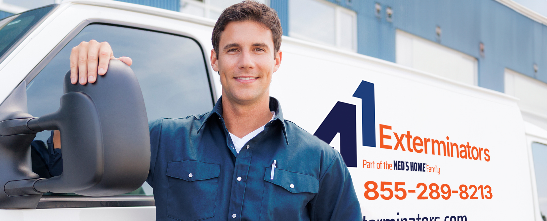 Service technician standing by van marked as A1 Exterminators